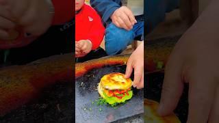 Chinese burger Fried fish tofu on stone slab